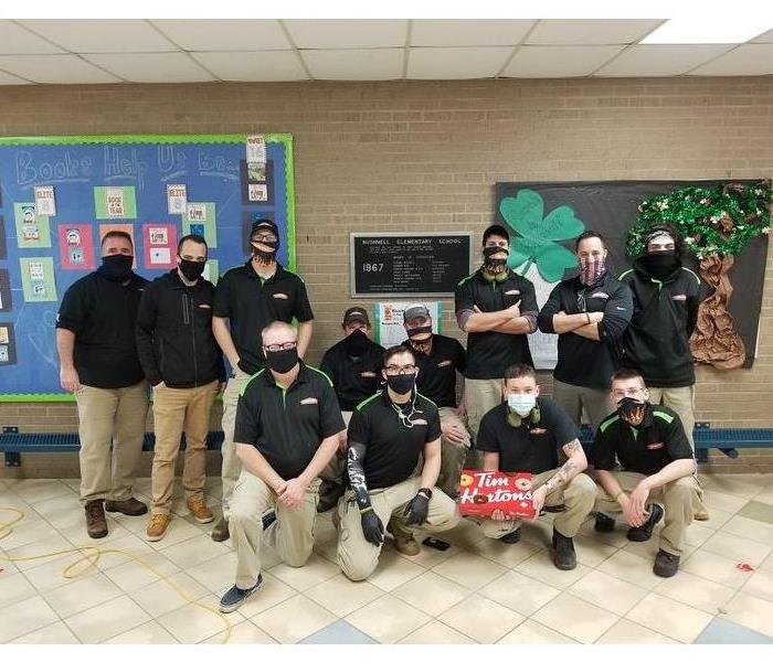 photo of servpro crew in masks at local school