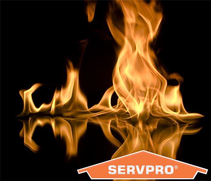 Orange Flames from a fire with SERVPRO house label